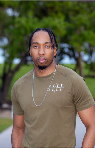 “GREATER IS HE” TEE