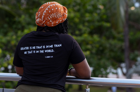 “GREATER IS HE” TEE